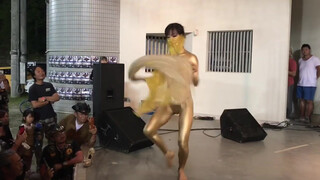 8. Dancer in gold body paint gets topless