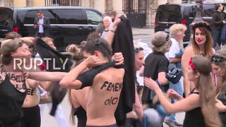 9. Topless FEMEN activists protest violence against women in Paris