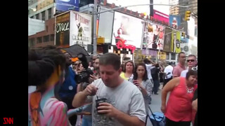 4. Andy Golub body paints model Tynisha Eaton in Times Square