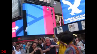 9. Andy Golub body paints model Tynisha Eaton in Times Square