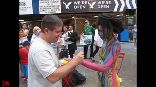 3. Andy Golub body paints model Tynisha Eaton in Times Square