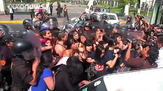 4. Topless protesters clash with police in Peru