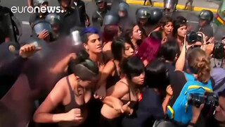 5. Topless protesters clash with police in Peru
