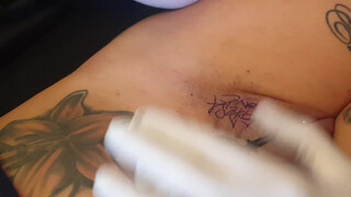 10. Tattoo above a shaved, pierced pussy (“Spesa one – Logo Tattoo Muschi”)