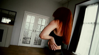 3. Beautiful, red-haired girl posing