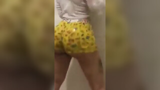2. She peels her shorts to her naked ass at 1:21