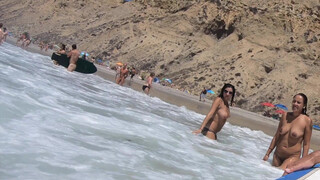 8. Nude girls enjoying the warm surf (1:42 or https://youtu.be/6ynpY-pHxUI?t=102)